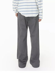 Men's relaxed fit grey cotton jeans with buttoned closure and classic back pockets.