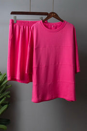 Relaxed seam detail sweatshirt and shorts set in bright pink.