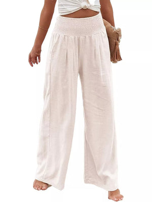 White smocked waist wide-leg maternity pants with a relaxed fit.