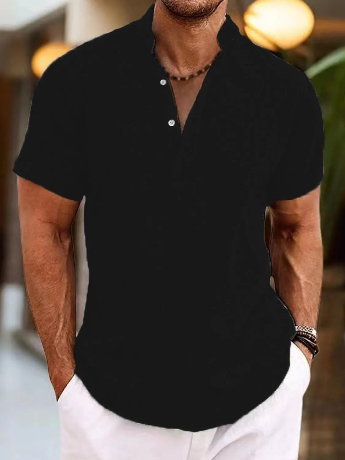 Black linen blend henley shirt with mandarin collar and button placket.