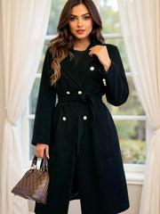 Black tailored double-breasted trench coat with waist tie and silver buttons.