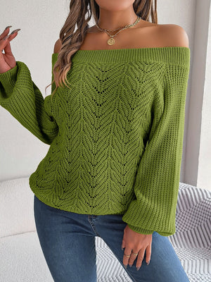 Moss green open-knit off-shoulder sweater with voluminous sleeves and leaf pattern.