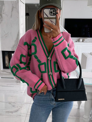 Hot Pink geometric chain knit cardigan with green trim and buttons.