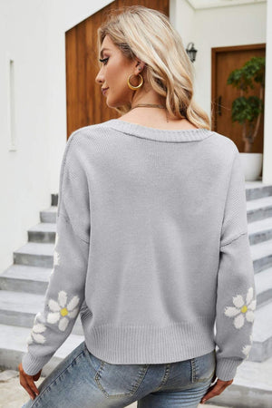 Gray acrylic knit cardigan with daisy embroidery on sleeves, V-neck, button front.