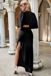 Black maxi dress with cut-out ring detail, short sleeves, and high slit.