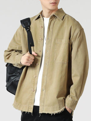 Khaki oversized button-up long-sleeve shirt with frayed hem and chest pocket.