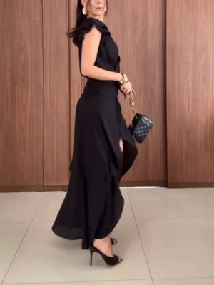 Black asymmetrical ruffle hem dress with cap sleeves and cinched waist.