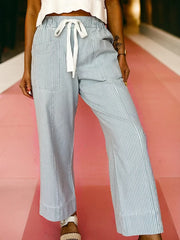Light blue striped drawstring jeans with a mid-rise and wide leg.
