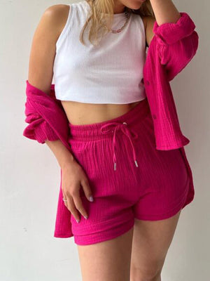 Textured gauze shirt and short co-ord set in blush pink, casual button-up style.
