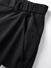 Men's black relaxed fit sweatpants with elastic waistband and side pockets.