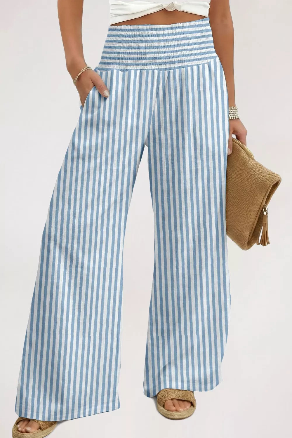 Blue and white striped cotton maternity pants with smocked waist and wide legs.