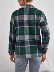 Oversized dark green plaid shacket with button closure, long sleeves, and collar.