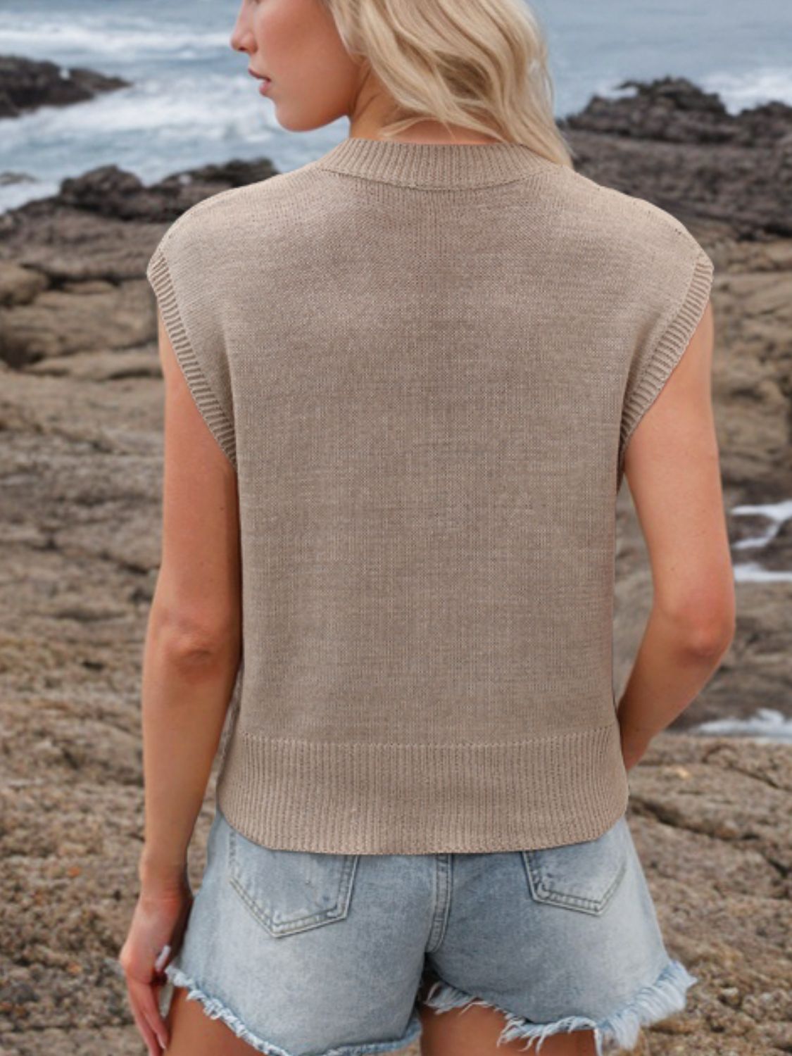 Sleeveless knit v-neck top in mocha with ribbed trim.