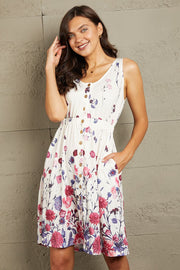White floral print button-down dress with elastic waist and pockets