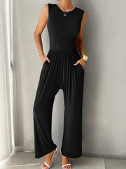 Black ribbed bodice wide leg jumpsuit with pockets and a cinched waist.