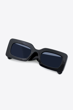 Black acetate rectangle sunglasses with dark lenses.