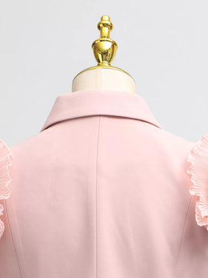 Pink skirt suit with elegant frill collar and balloon sleeves.