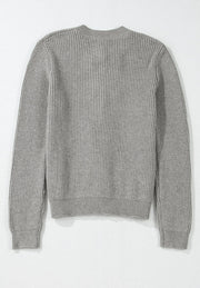 Gray ribbed knit cardigan with long sleeves and a mock neckline.