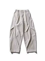 Men's loose fit cargo pants in gray with multiple pockets and elastic waistband.