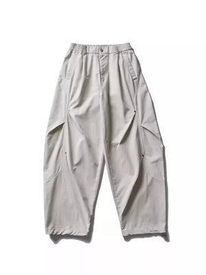 Men's loose fit cargo pants in gray with multiple pockets and elastic waistband.