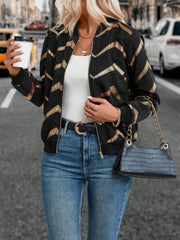 Black bomber jacket with gold chevron sequin pattern and zip front.