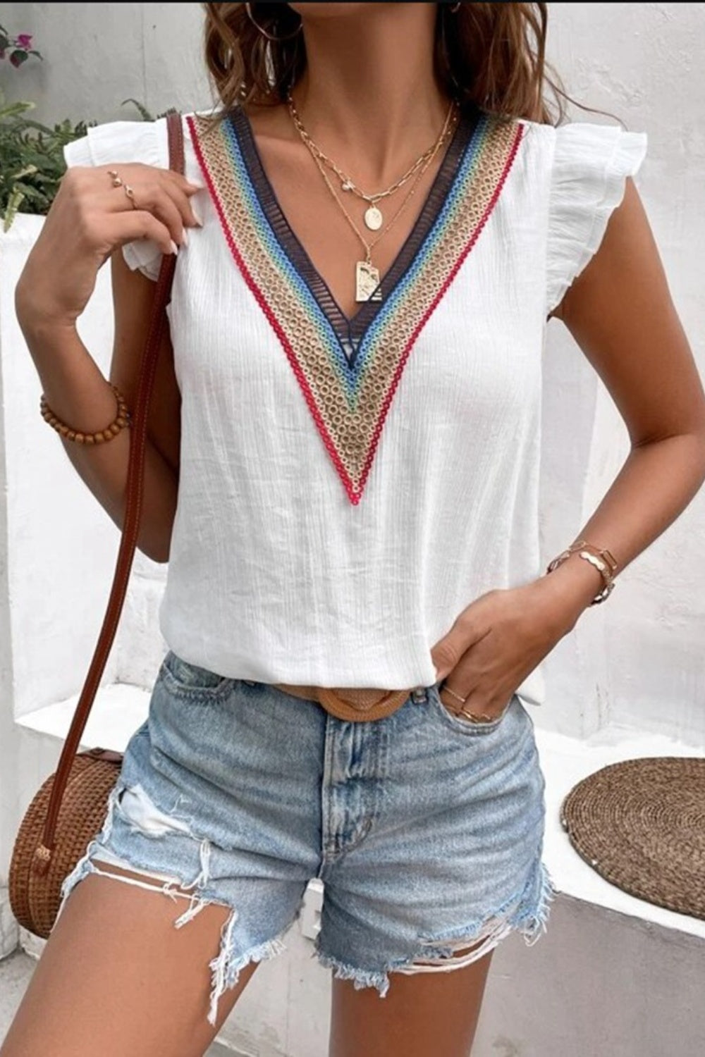White flutter sleeve blouse with colorful embroidered trim V-neck