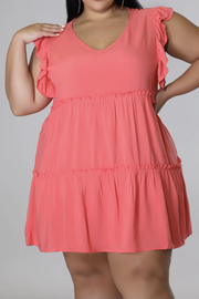 Coral tiered ruffle babydoll mini dress with v-neck and flutter sleeves.