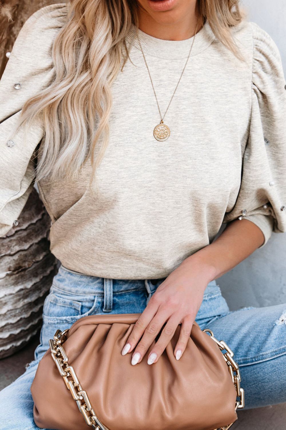 Light gray embellished puff sleeve sweatshirt with pearl and rhinestone details.
