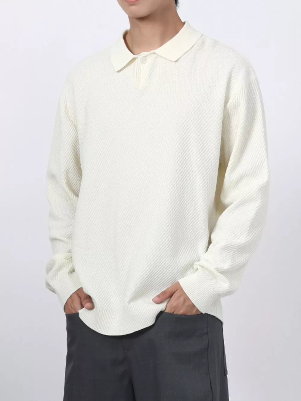 Men's textured knit polo shirt in white with a classic collar and button placket.