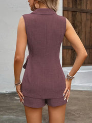 Sleeveless blazer and tailored shorts set in mauve with textured fabric and a tie detail.
