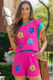 Hot Pink sequin floral colorblock lounge set with shorts and short sleeve top.