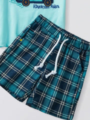 Toddler graphic tee with "Adventure Awaits" text and blue plaid shorts with drawstring.