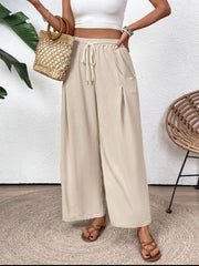Tan Luxe Drape Palazzo Trousers with drawstring waist and pockets.