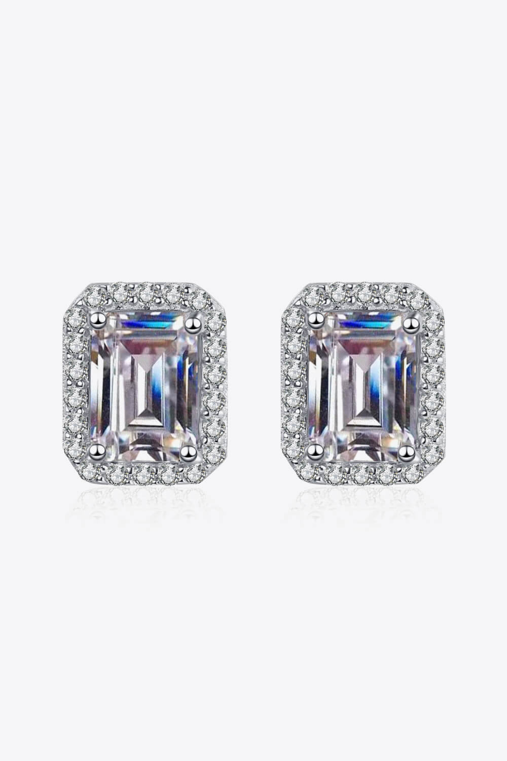Radiant Emerald Cut Halo Studs in silver with sparkling cubic zirconia accents.