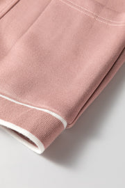 Dusty pink cocoon cardigan with white varsity trim detail