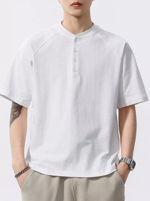 Men's white buttoned henley t-shirt with short sleeves and a band collar.