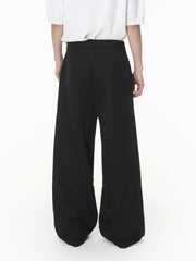 Black wide-leg pleated sweatpants with a belted waist and two back pockets.