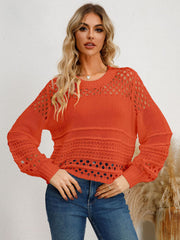Orange-Red openwork knit sweater with crew neck and long sleeves.