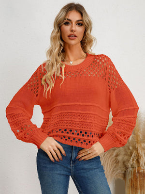 Orange-Red openwork knit sweater with crew neck and long sleeves.
