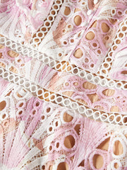 Pink floral lace maxi gown with cutout details and button accents.