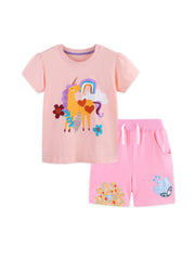 Pink cotton toddler unicorn graphic t-shirt and shorts set with rainbow and flower details.
