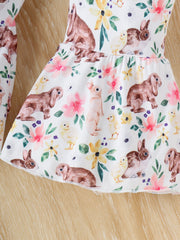 Baby set with white fabric, bunny and chick print, and floral accents.