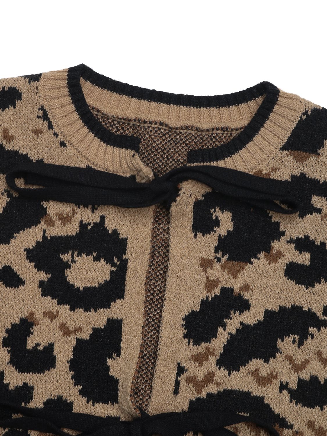 Tan leopard print acrylic knit cardigan with black bow-tie detail at neckline