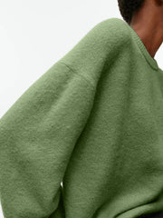 Oversized brushed knit crewneck sweater in Gum Leaf green with relaxed fit and crew neckline.