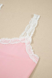 Pink ribbed cami pajama top with white lace trim and straps.