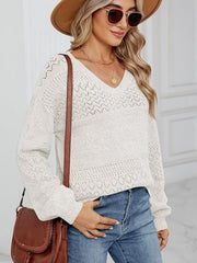 White eyelet stitch v-neck pullover sweater with textured knit details.