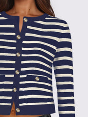 Navy and white striped cropped cardigan with gold buttons and pockets.