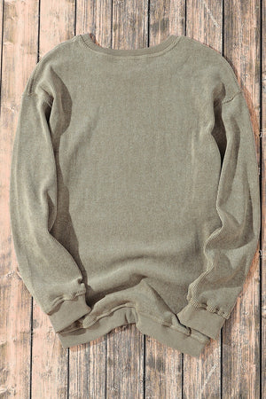 Textured ribbed crewneck pullover in Sage, featuring a relaxed fit and long sleeves.