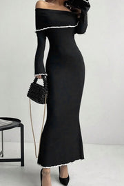 Black off-shoulder maxi dress with ruffled trim and long sleeves.