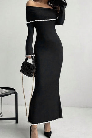 Black off-shoulder maxi dress with ruffled trim and long sleeves.